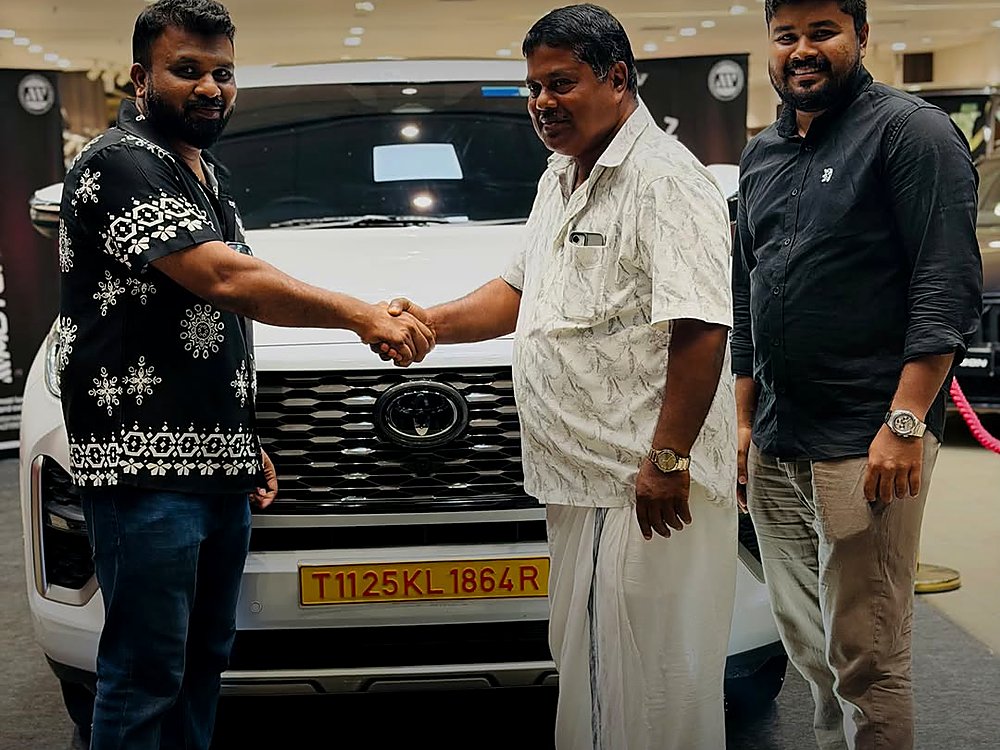A customer taking delivery of his car